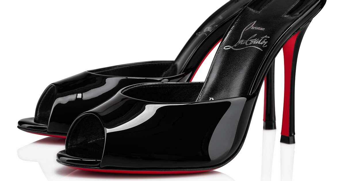 Christian Louboutin Me Dolly mule in black patent, showing the signature red sole