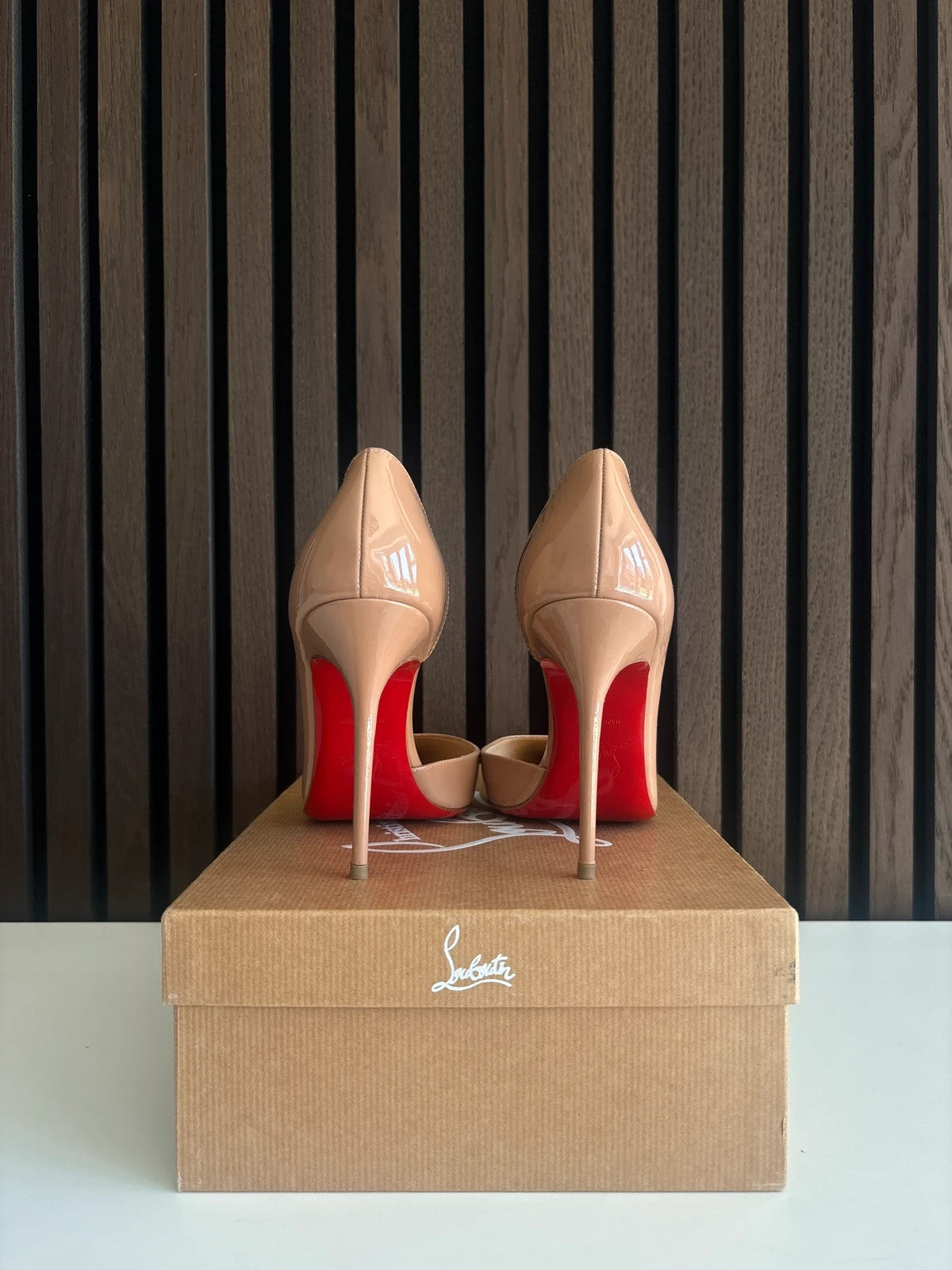 Christian Louboutin Iriza Nude (image 4) Christian Louboutin Iriza 100 Nude Patent Leather Heels - red sole detail