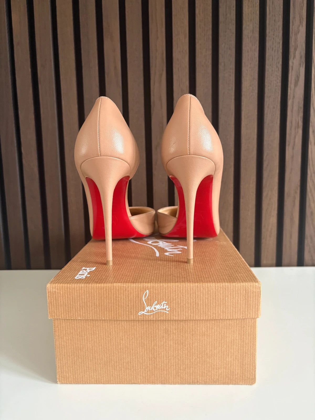 Christian Louboutin Iriza Nude (image 4) Christian Louboutin Iriza 100 Nude Leather Heels - red sole detail