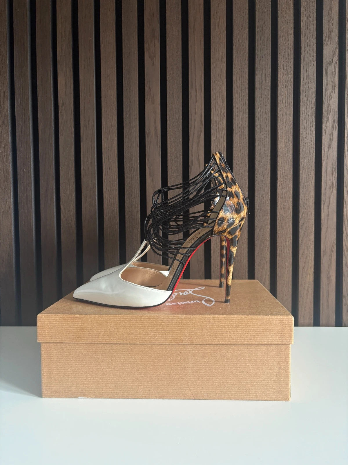 Christian Louboutin Confusa White (image 4) Christian Louboutin Confusa 100 White Patent Leather T-strap Heels - red sole detail