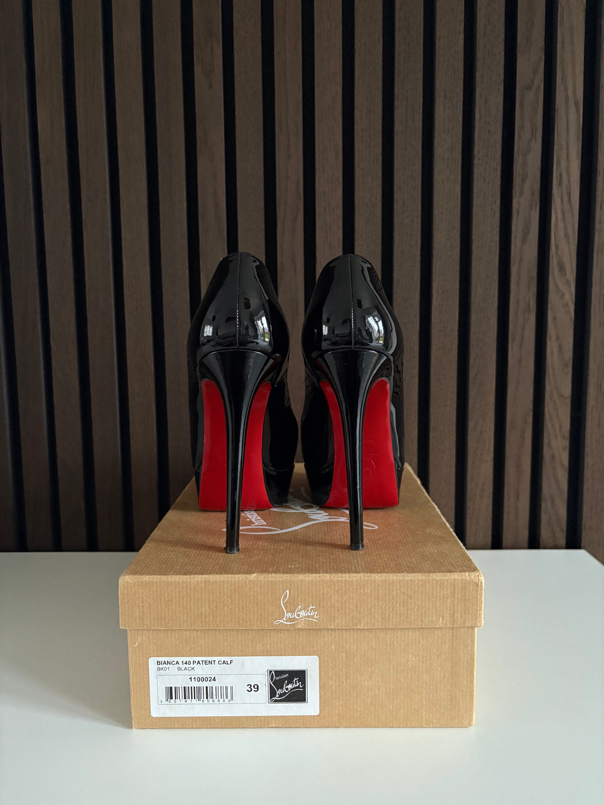 Christian Louboutin Bianca Black Patent Leather, pre-owned authenticated UK, side view Christian Louboutin Bianca Black Patent Leather Heels (EU 39 / UK 6) - alternate angle