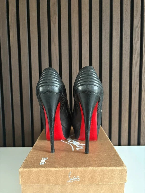 Christian Louboutin Futura 100mm heel Black Leather, pre-owned authenticated UK, heel and sole detail Christian Louboutin Futura Platform Ankle Biker Boots (EU 39 / UK 6) - detail view