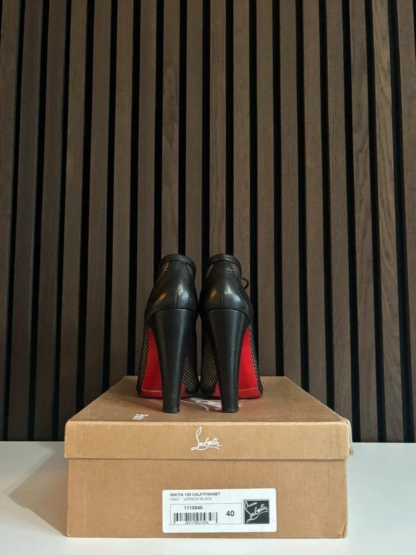 Christian Louboutin Nikita 100mm heel Black Leather, pre-owned authenticated UK, heel and sole detail Christian Louboutin Nikita Fishnet Ankle Boots Black (EU 40 / UK 7) - detail view