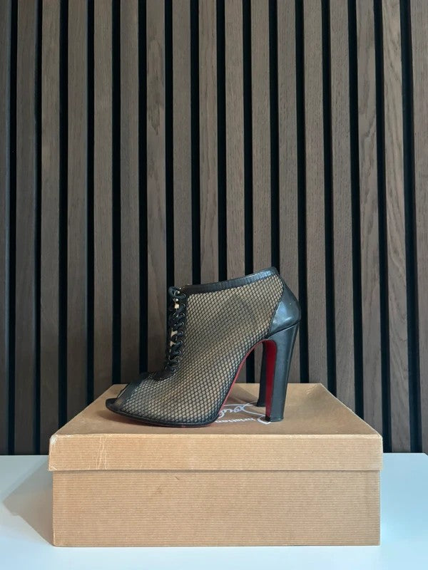 Christian Louboutin Nikita 100mm heel Black Leather, pre-owned authenticated UK Christian Louboutin Nikita Fishnet Ankle Boots Black (EU 40 / UK 7) - main product view
