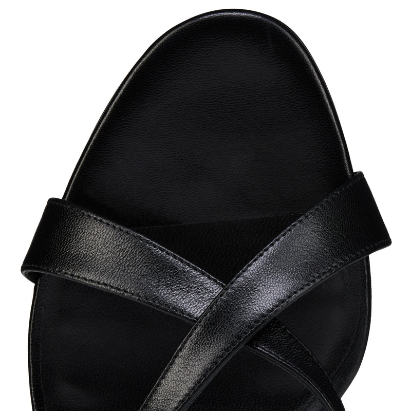 Christian Louboutin Mulazee Cross on a white background