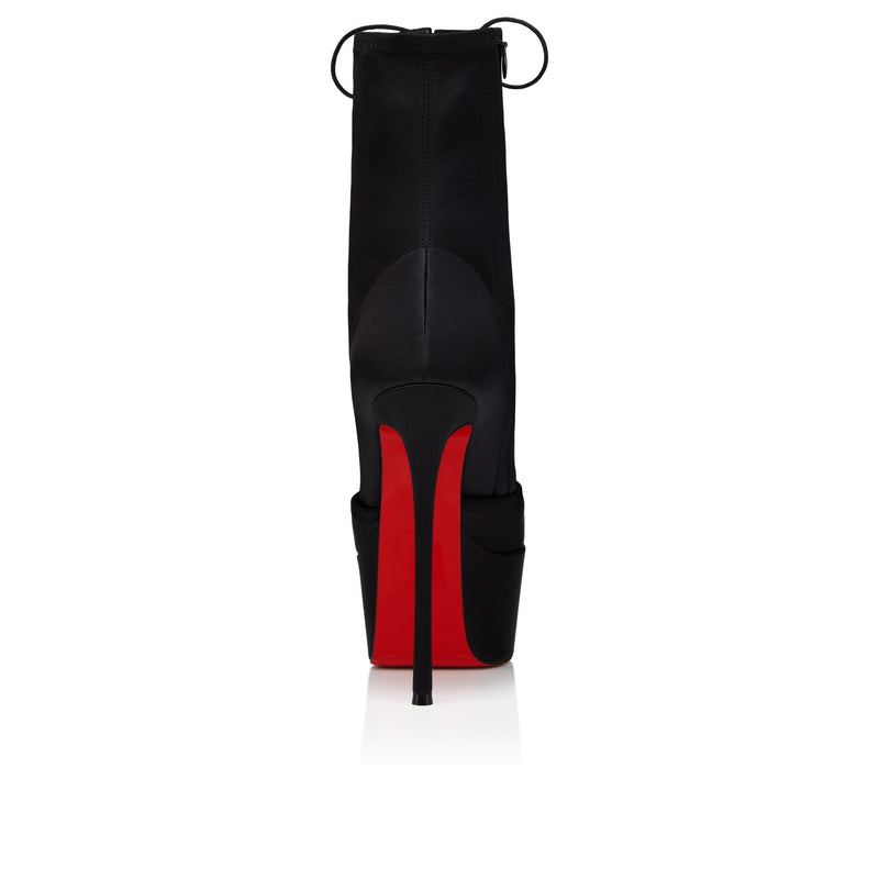 Christian Louboutin Pavlova Booty Alta on a white background